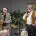 Lions Bob Clay, left, and Dale Sherman lead last year&rsquo;s Coupeville Lions Scholarship Auction. File photo