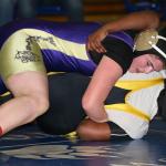 Meredith Bain tries to turn her opponent Saturday. The senior went on to win her bracket. (Photo by John Fisken)