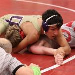 Oak Harbor&rsquo;s Caleb Fitzgerald pins Antonio Bernocco in the second round. (Photo by John Fisken)