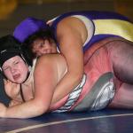 Wendolyn Martinez, top, controls her opponent. (Photo by John Fisken)
