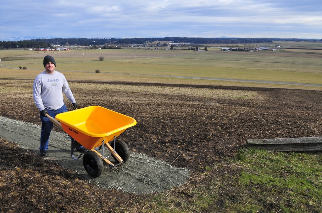 Thomas Skurnick, a second class petty officer from NAS Whidbey Isand, helps to restore the prairie overlook trail at Ebey&rsquo;s National Historical Reserve, Monday in Coupeville.The project was part of a veteran&rsquo;s group project along with members of the National Park Conservation Association to help out with a backlong of needed maintenance in the National Park System. Photo by Michael Watkins/Whidbey News-Times