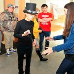 Photo by Michael Watkins/Whidbey News-Times AJ Diamond, right helps Levi Gonzalez, an 11th-grade blind and autisitic student with a special hat created by the Oak Harbor High School advanced robotics team Thursday in Oak Harbor. The hat was fitted with ultrasonic sensors that transmit information to small vibrating motors that alerts the wearer to location and distance of obstacles.