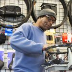 Dean Lewis tightens tennis racquet strings at his Oak Harbor shop, Dean&rsquo;s SportsPlus, which has specialized in bicycles, repairs and other sports for nearly 30 years.                                Photo by Patricia Guthrie/Whidney News-Times