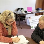 Dana Sawyers, coordinator for Island County Veterans Services, goes through a series of survey questions with veteran Wayne Martin. Photo by Patricia Guthrie/Whidbey News-Times