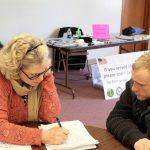 Dana Sawyers, coordinator for Island County Veterans Services, goes through a series of survey questions with Wayne Martin. Collecting more information about area veterans could lead to new assistance programs. Photo by Patricia Guthrie/Whidbey News-Times