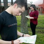 Varsity NJROTC orienteering team members Kelly Holt, left, and Megan Peek prepare for nationals Wednesday, Feb. 15, in a courtyard at Oak Harbor High School. OHHS placed 14th out of 29 teams. Photo by Dan Warn/Whidbey News-Times