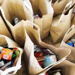 The Food4Kids program delivers groceries to 86 students at five Oak Harbor elementary schools to help get them through the weekend. Local company, Idex Health & Science, recently donated $10,000 toward the Rotary Club program.                                Photo by Patricia Guthrie/Whidey News-Times