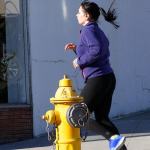A jogger passes a fire hydrant along Pioneer Way in historic downtown Oak Harbor Monday. The city is considering allowing artists to paint the hydrants along Pioneer Way. Photo by Ron Newberry/Whidbey News-Times
