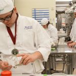 Donovan McCulley, foreground, and other Oak Harbor High School students work on preparing dishes during Chef Mary Arthuer&rsquo;s culinary arts class Thursday, Feb. 23, 2017. The school&rsquo;s culinary arts team won a state championship for the eighth time in 12 years on Saturday and will now advance to the National ProStart Invitational in Charleston, S.C. Photo by Ron Newberry/Whidbey News-Times