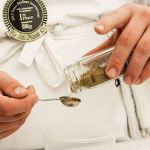 Donovan McCulley of Oak Harbor High School measures out coriander while preparing potato and pea samosa during culinary arts class Thursday, Feb. 23, 2017. The school&rsquo;s culinary arts team won a state championship for the eighth time in 12 years on Saturday and will now advance to the National ProStart Invitational in Charleston, S.C. Photo by Ron Newberry/Whidbey News-Times