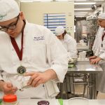 Donovan McCulley, foreground, and other Oak Harbor High School students work on preparing dishes during Chef Mary Arthur&rsquo;s culinary arts class Thursday, Feb. 23, 2017. The school&rsquo;s culinary arts team won a state championship for the eighth time in 12 years on Saturday and will now advance to the National ProStart Invitational in Charleston, S.C. Photo by Ron Newberry/Whidbey News-Times