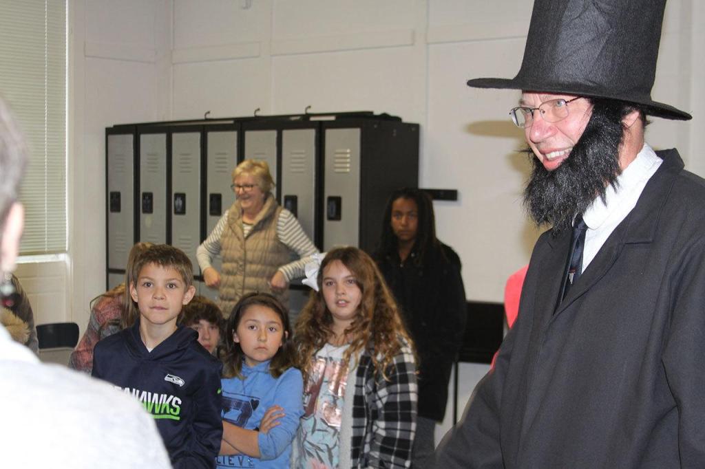 Alan Schell of Oak Harbor dresses up as Abraham Lincoln and impersonates the former U.S. president in the spirit of President&rsquo;s Day Wednesday, Feb. 15, 2017 at Oak Harbor Christian School. Children from kindergarten through sixth grade attended the address. Photo by Ron Newberry/Whidbey News-Times