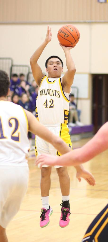 Joe Arinaza shoots for Oak Harbor in Tuesday&rsquo;s win. Arinaza opened the game by draining a three-pointer. (Photo by John Fisken)