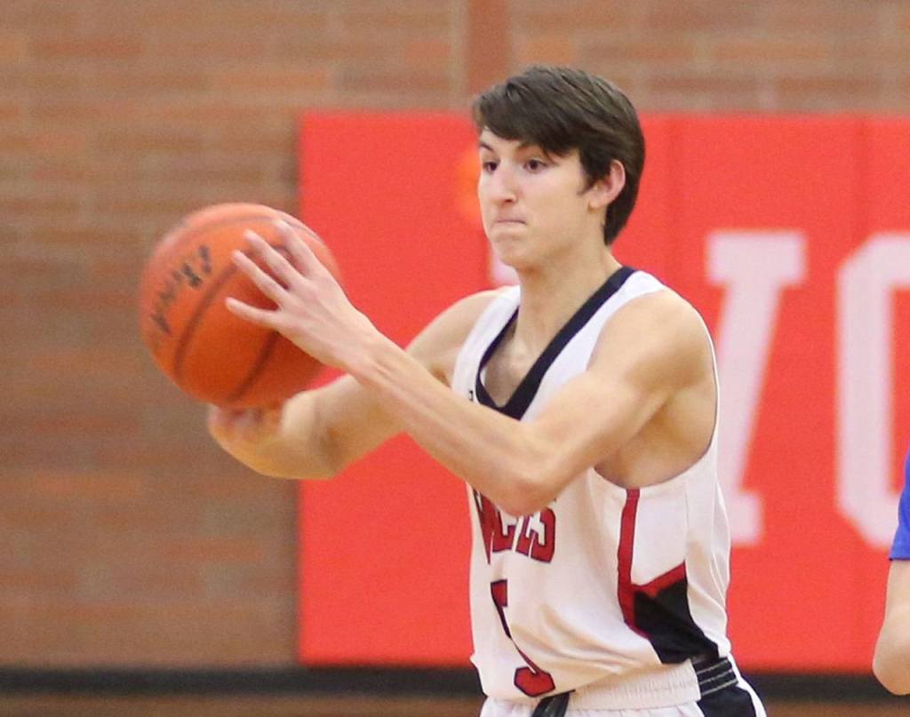 Coupeville&rsquo;s Joey Lippo prepares to pass for the Wolves. (Photo by John Fisken)