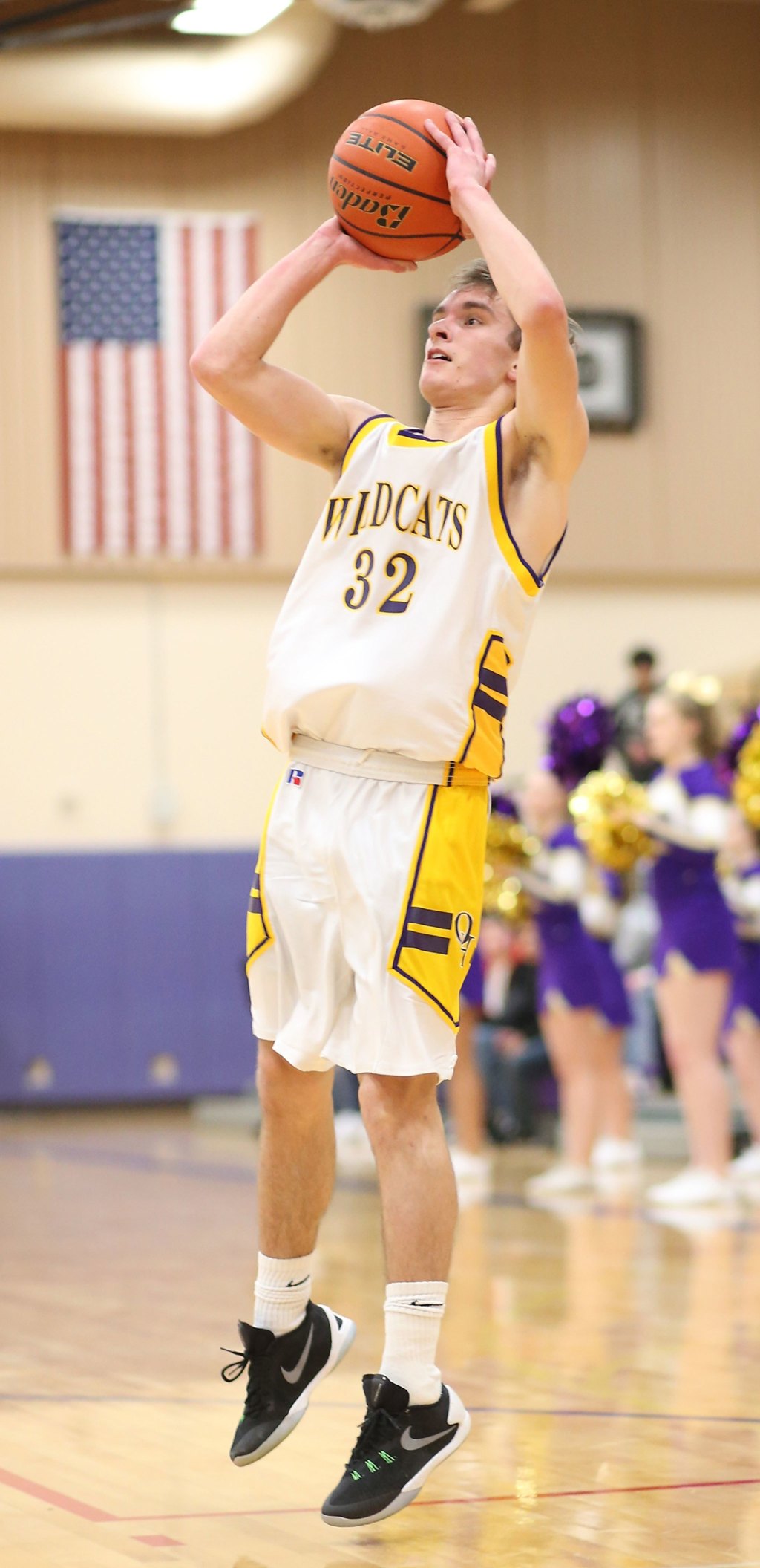 Adam Nelson puts up a jump shot in the win over Burlington-Edison. (Photo by John Fisken)