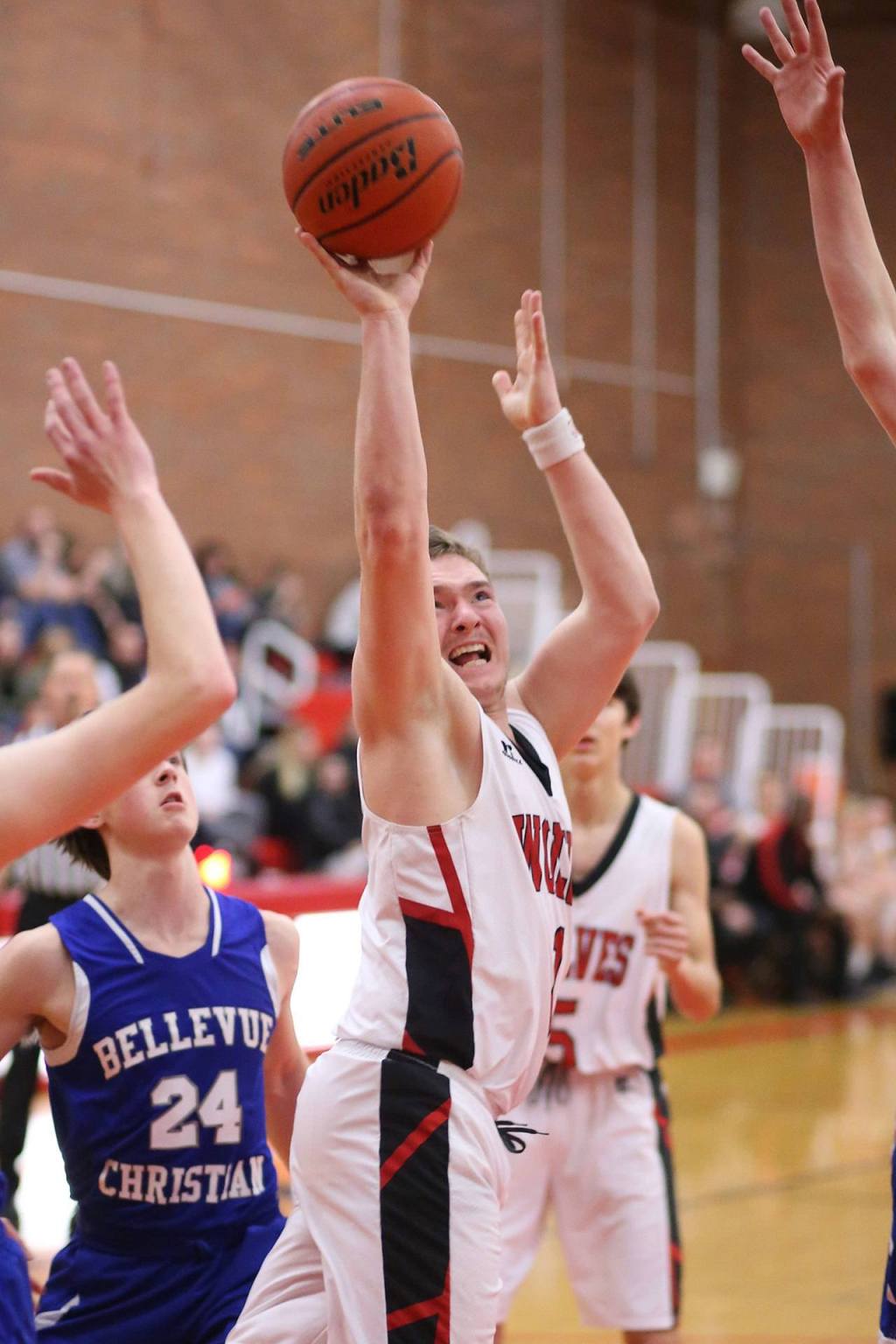 Gabe Wynn attacks the hoop for Coupeville. (Photo by John Fisken)