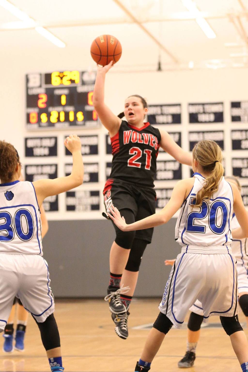 Mia Littlejohn shoots a floater during the first quarter. (Photo by John Fisken)