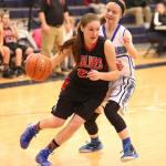 Mikayla Elfrank attacks the baseline Thursday. (Photo by John Fisken)