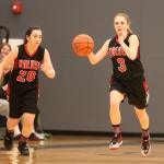 Lauren Grove leads a Coupeville fastbreak as Kalia Littlejohn (20) fills a lane. (Photo by John Fisken)