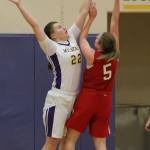 Julie Jansen rejects a shot by M-P&rsquo;s Lauren Carson. (Photo by Jim Waller/Whidbey News-Times)
