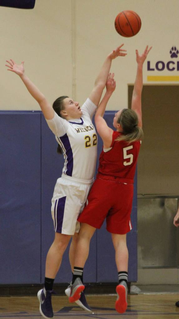 Julie Jansen rejects a shot by M-P&rsquo;s Lauren Carson. (Photo by Jim Waller/Whidbey News-Times)