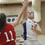 Bryn Langrock shoots a floater over M-P&rsquo;s Mackenzie Connelly. (Photo by Jim Waller/Whidbey News-Times)