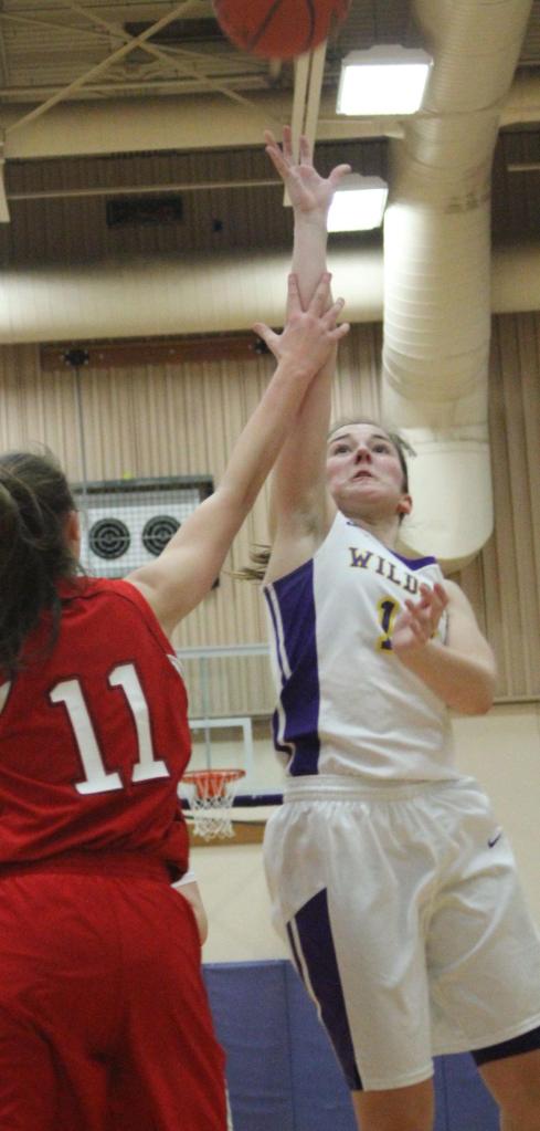 Bryn Langrock shoots a floater over M-P&rsquo;s Mackenzie Connelly. (Photo by Jim Waller/Whidbey News-Times)