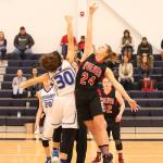 Lindsey Roberts (24) out-jumps Cascade Christian&rsquo;s Kiriana Shelton on the opening tip. (Photo by John Fisken)