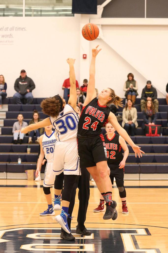 Lindsey Roberts (24) out-jumps Cascade Christian&rsquo;s Kiriana Shelton on the opening tip. (Photo by John Fisken)