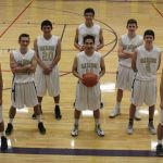 Eight of the 11 members of the Oak Harbor High School boys basketball team have grade point averages of 3.2 or above. From the left are Gavin Allen, Adam Nelson, Weston Whitefoot, Ty Baker (front), Ozell Jackson, Kevin Schuldt, Gabe Salinger and JJ Mitchell. (Photo by Jim Waller/Whidbey News-Times)