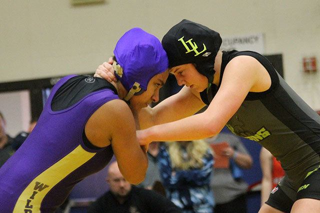 Diandra Dominguez, left, locks up with Lynden&rsquo;s Kali Spady. (Photo by Jim Waller/Whidbey News-Times)