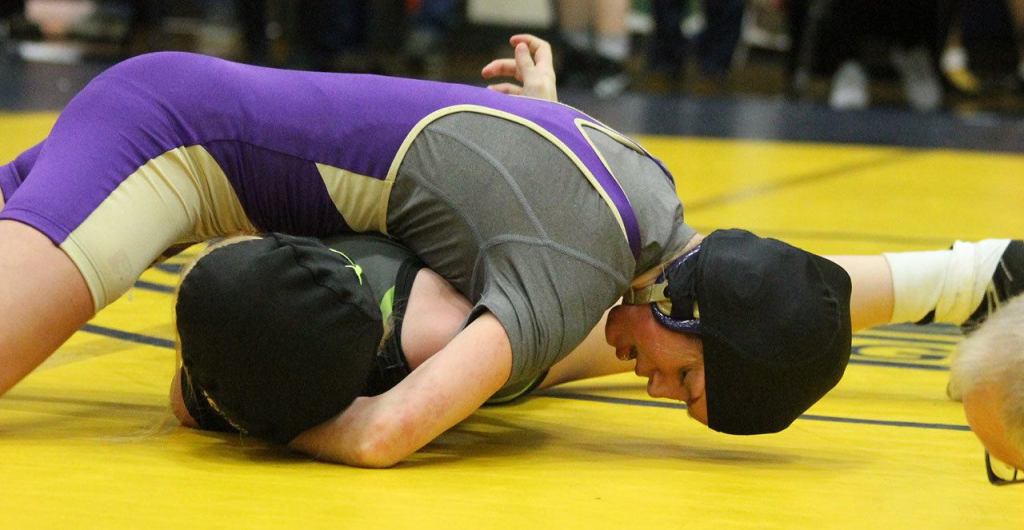 Oak Harbor&rsquo;s Ella Erikson pins Lynden&rsquo;s Crystal Cuellar. (Photo by Jim Waller/Whidbey News-Times)