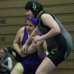 Wendoyn Martinez gets a leg up on Lynden&rsquo;s Brandy Vis. (Photo by Jim Waller/Whidbey News-Times)