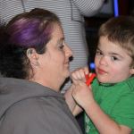 Taci Belisle holds her 3-year-old son Ryder at a fundraising event, &ldquo;We Believe in Ryder,&rdquo; at The Loakal Public House in Oak Harbor Wednesday, Feb. 1, 2017. The benefit was organized by Oak Harbor&rsquo;s Brandy Ledesma, who plays Mrs. Claus at the Pacific Winds Farm during the holiday season. A silent auction, raffle and bingo took place to help support the Belisle family of Sedro Woolley and in particular 3-year-old Ryder Belisle, who suffers from a rare terminal disease Sanfilippo Syndrome, which is like an Alzheimer&rsquo;s for children. Photo by Ron Newberry/Whidbey News-Times