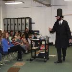 Alan Schell of Oak Harbor dresses up as Abraham Lincoln and impersonates the former U.S. president in the spirit of President&rsquo;s Day Wednesday, Feb. 15, 2017 at Oak Harbor Christian School. Children from kindergarten through sixth grade attended the address. Photo by Ron Newberry/Whidbey News-Times