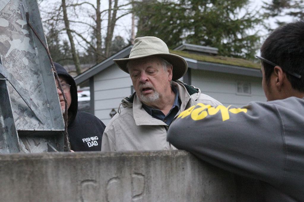 Doug Smith, commissioner with the Admiral&rsquo;s Cove Water District, watches as a sampler from CH2M, a global engineering company and contractor for the Navy, gets ready to test water from one of the district&rsquo;s community wells Monday, Feb. 20, 2017. The tests were conducted to look for certain chemicals that might&rsquo;ve come from Coupeville&rsquo;s Outlying Landing Field. Photo by Ron Newberry/Whidbey News-Times.