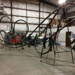 The framework of &ldquo;Autumn Leaves,&rdquo; a metal sculpture bound for Oak Harbor, rests at Architectural Elements in Bellingham. Nora O&rsquo;Connel-Balda, a member of the Oak Harbor Arts Commission, stands at right. Photo courtesy Skip Pohtilla
