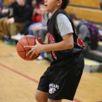North Whidbey seventh-grader Gabriel Fluhr gets ready to fire up a shot. (Photo by John Fisken)