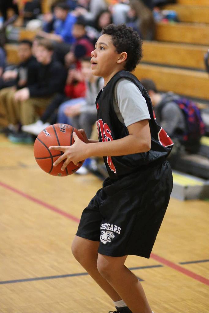 North Whidbey seventh-grader Gabriel Fluhr gets ready to fire up a shot. (Photo by John Fisken)