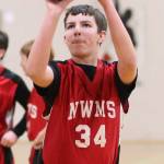 North Whidbey eighth-grader Henry Booth puts up a free throw in Tuesday&rsquo;s showdown with Oak Harbor Middle School. (Photo by John Fisken)