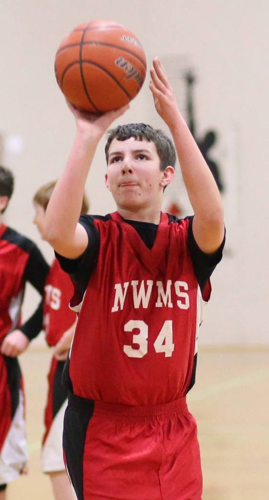 North Whidbey eighth-grader Henry Booth puts up a free throw in Tuesday&rsquo;s showdown with Oak Harbor Middle School. (Photo by John Fisken)