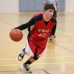 Tyler Zenger, a North Whidbey eighth-grader, looks for an opening in the Oak Harbor defense. (Photo by John Fisken)