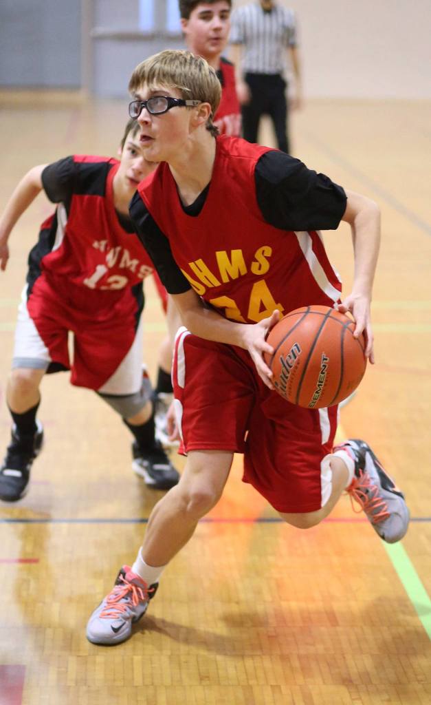 Colton Livingston scored 12 points, grabbed 12 rebounds, recorded 4 blocks, snared 1 steal and dished out 2 assists for the Oak Harbor eighth-graders. (Photo by John Fisken)