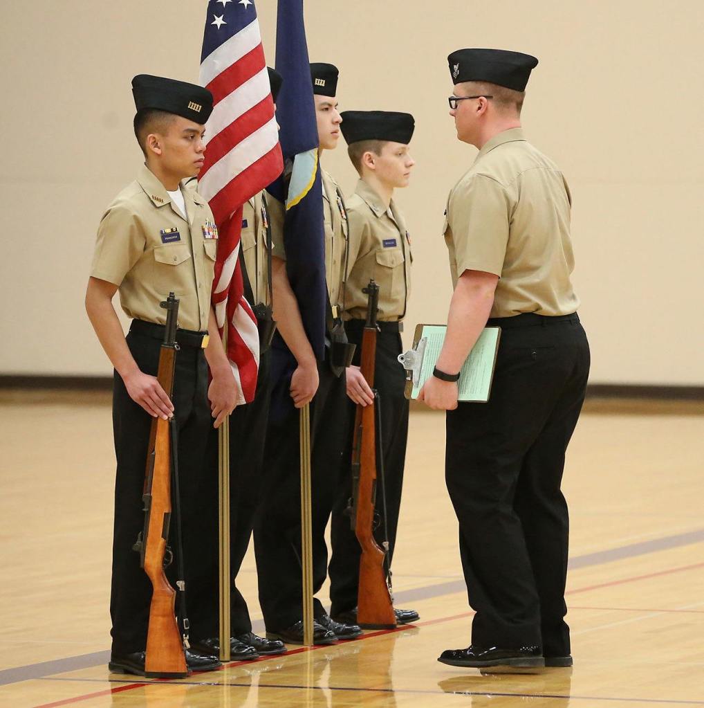Jonathan Francisco, left, Clifford Hartley, Alex Hartley and Tristin Macaluso being inspected by AE1 Dylan Biddle, CNATTU Whidbey. (Photo by John Fisken)