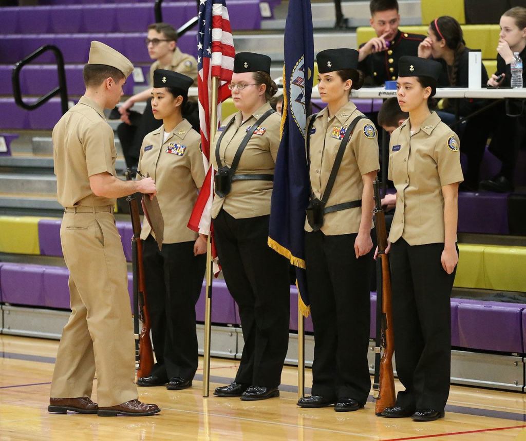 Shaina Aquirre, left, Mikayla Hobbs, Taylor Kesler and Jasmine Schultz being inspected by Ltjg Rob Morris, VAQ-129.(Photo by John Fisken)