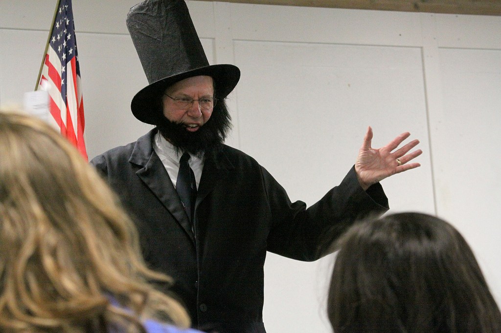 Alan Schell of Oak Harbor dresses up as Abraham Lincoln and impersonates the former U.S. president in the spirit of President&rsquo;s Day Wednesday, Feb. 15, 2017 at Oak Harbor Christian School. Children from kindergarten through sixth grade attended. Photo by Ron Newberry/Whidbey News-Times