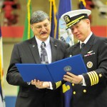 Capt. Trevor Estes, VAQ-129&rsquo;s fleet replacement training commanding officer, reads a letter to Joe Farina on behalf of the Chief of Naval Operations. The letter designated him as the 29th Honorary Naval Aviator.                                Capt. Trevor Estes, VAQ-129&rsquo;s fleet replacement training commanding officer, reads a letter to Joe Farina on behalf of the Chief of Naval Operations. The letter designated him as the 29th Honorary Naval Aviator.