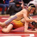 Oak Harbor&rsquo;s Jakob Dailey, top, tangles with Tanner Laurzon of Marysville-Pilchuck in the bout for third and fourth places. Laurzon eventually won the match with a fall. (Photo by John Fisken)