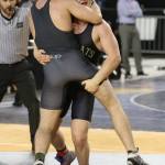 Nick Dugin goes for a takedown. (Photo by John Fisken)