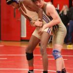 Oak Harbor teammates Tayvion Shaw, left, and William Nickelson meet in the fifth/sixth-place match won by Nickelson 4-3. (Photo by John Fisken)